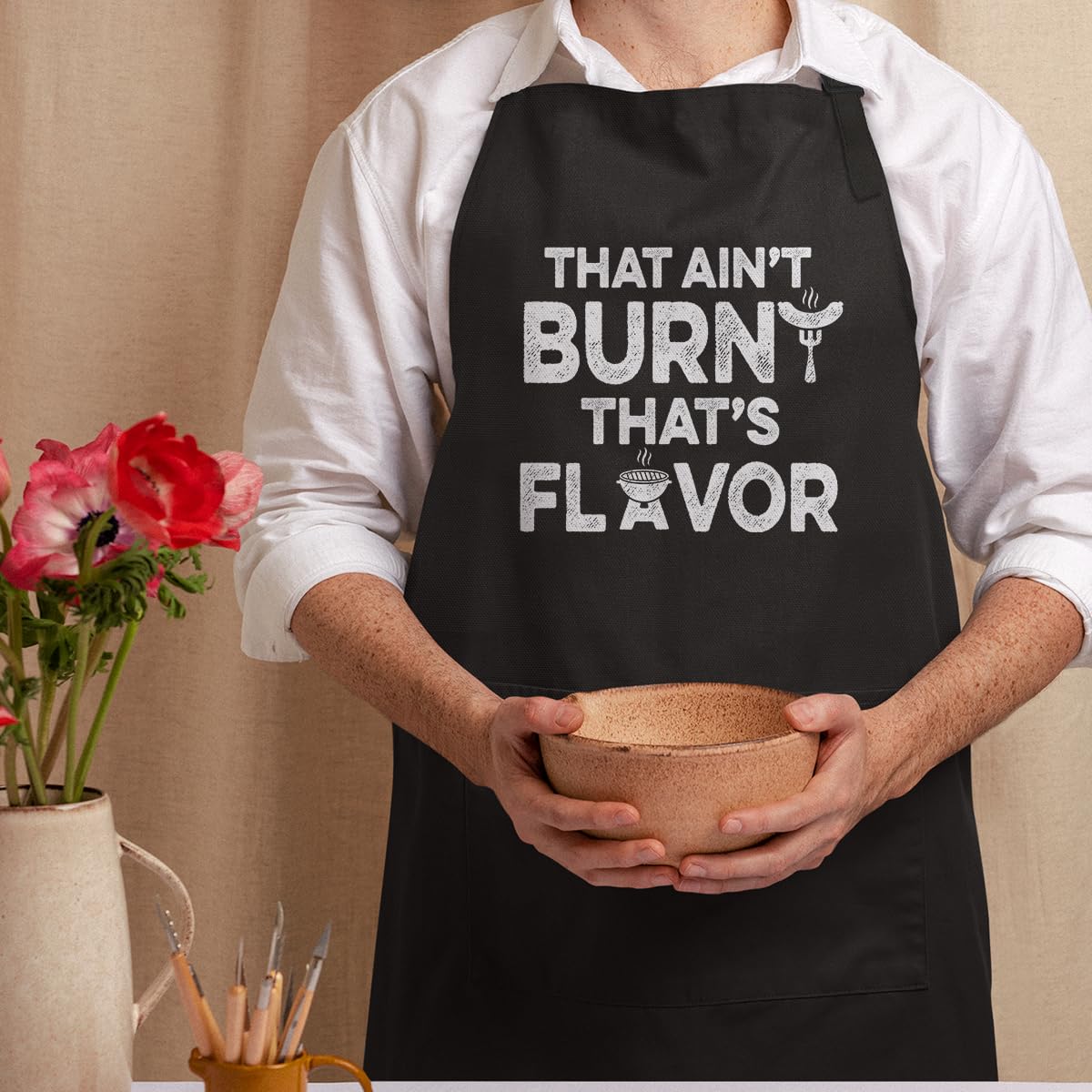 SANDJEST kitchen apron comes in multiple colors for matching your personal style.