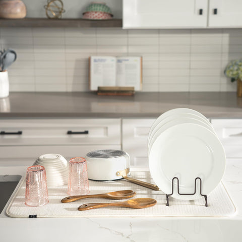 S&T INC. 18x30 cream mat placed under a dish rack protects counters and drains water.