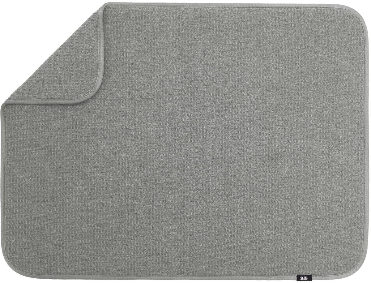 S&T INC. dish drying mat XL 18x24 on counter absorbs water and keeps surfaces dry.