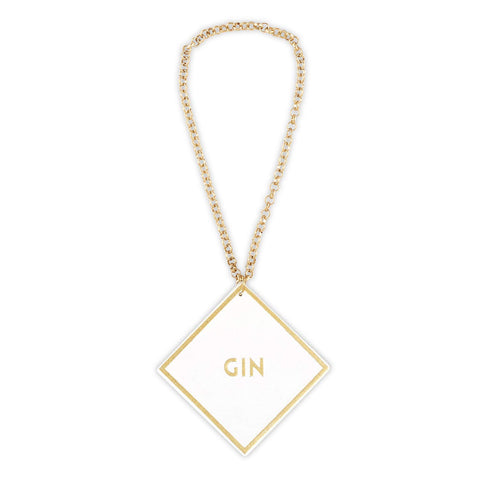 Close-up of the white leather tag with gold foil detailing.