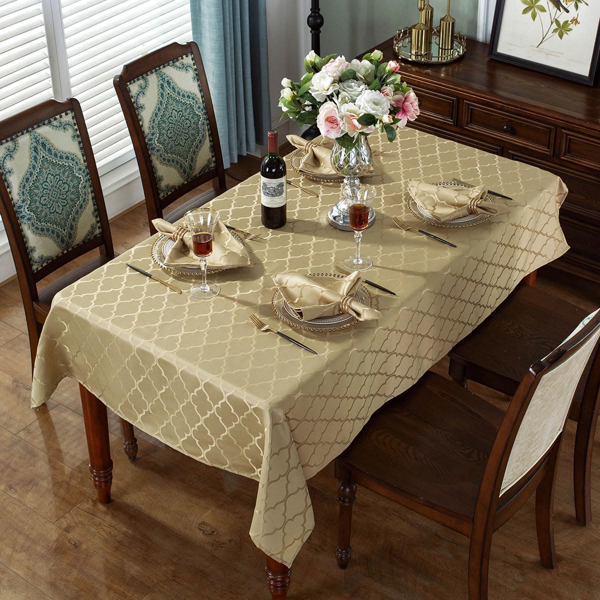 Closeup of SASTYBALE jacquard weave detail on gold tablecloth.