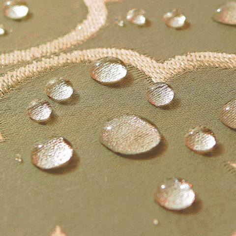 SASTYBALE jacquard tablecloth easy-clean feature demonstrated with damp cloth.