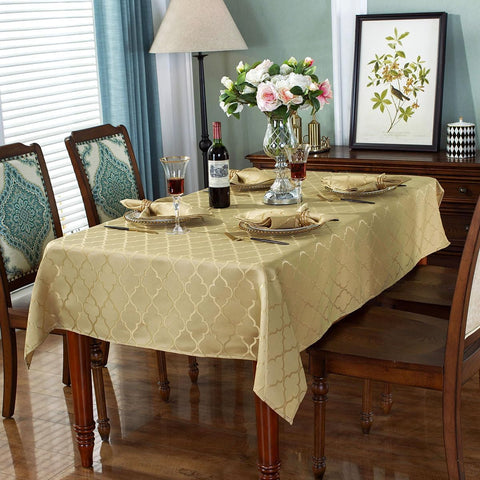 SASTYBALE jacquard tablecloth in gold on a dining setup, enhancing festive ambiance.