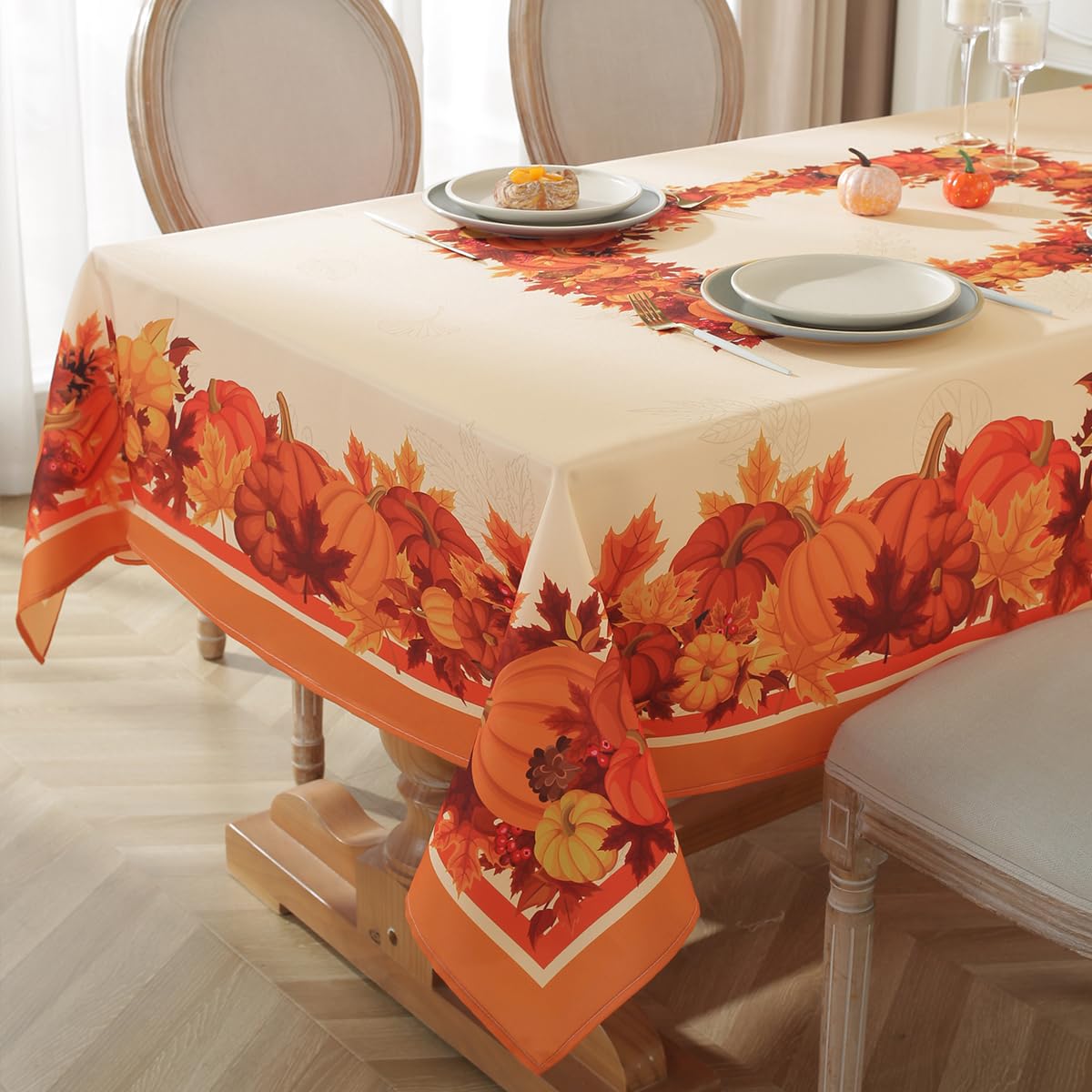 SASTYBALE pumpkin tablecloth on beige background protects your table from spills.