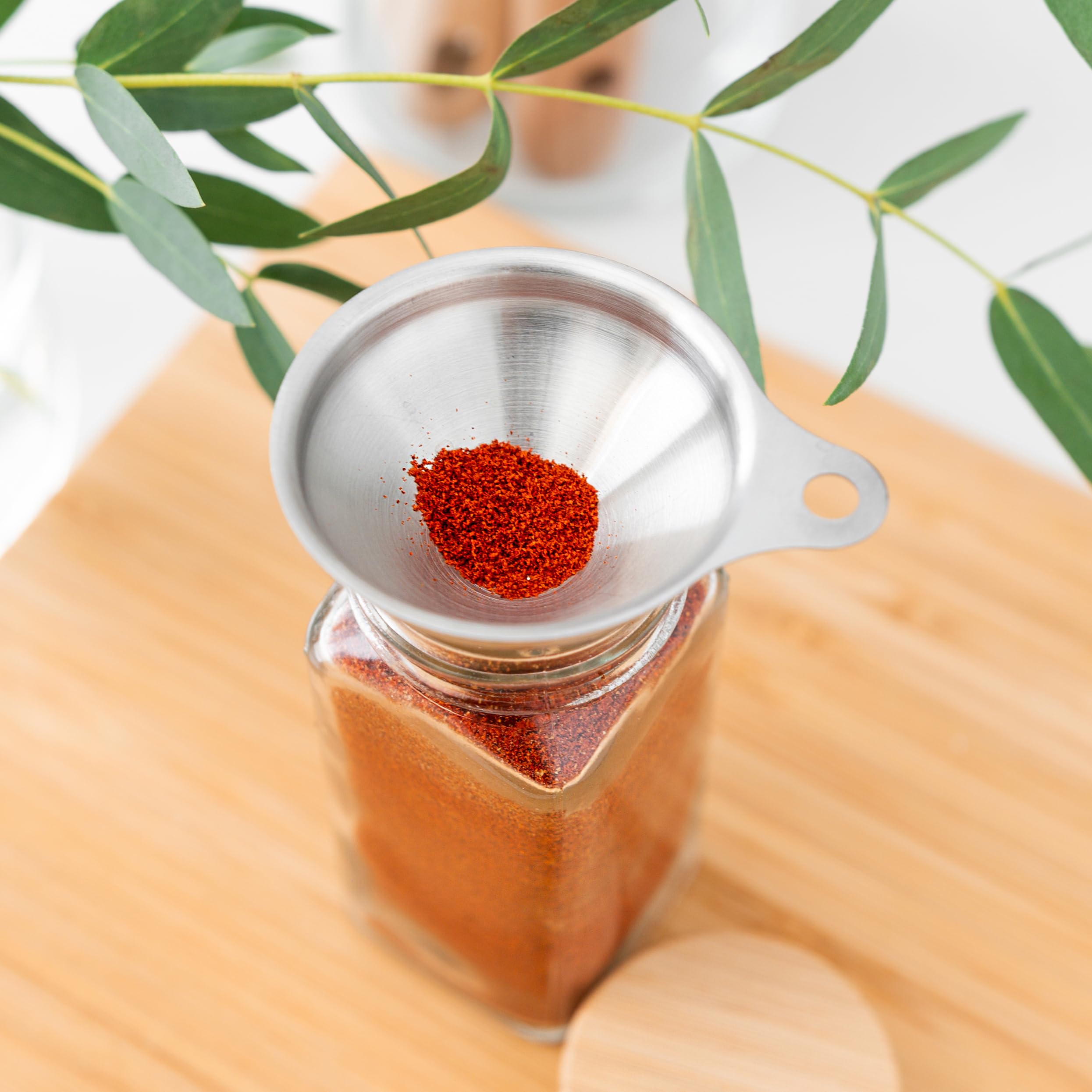 Savvy & Sorted stainless steel funnel aids spill-free transfers.