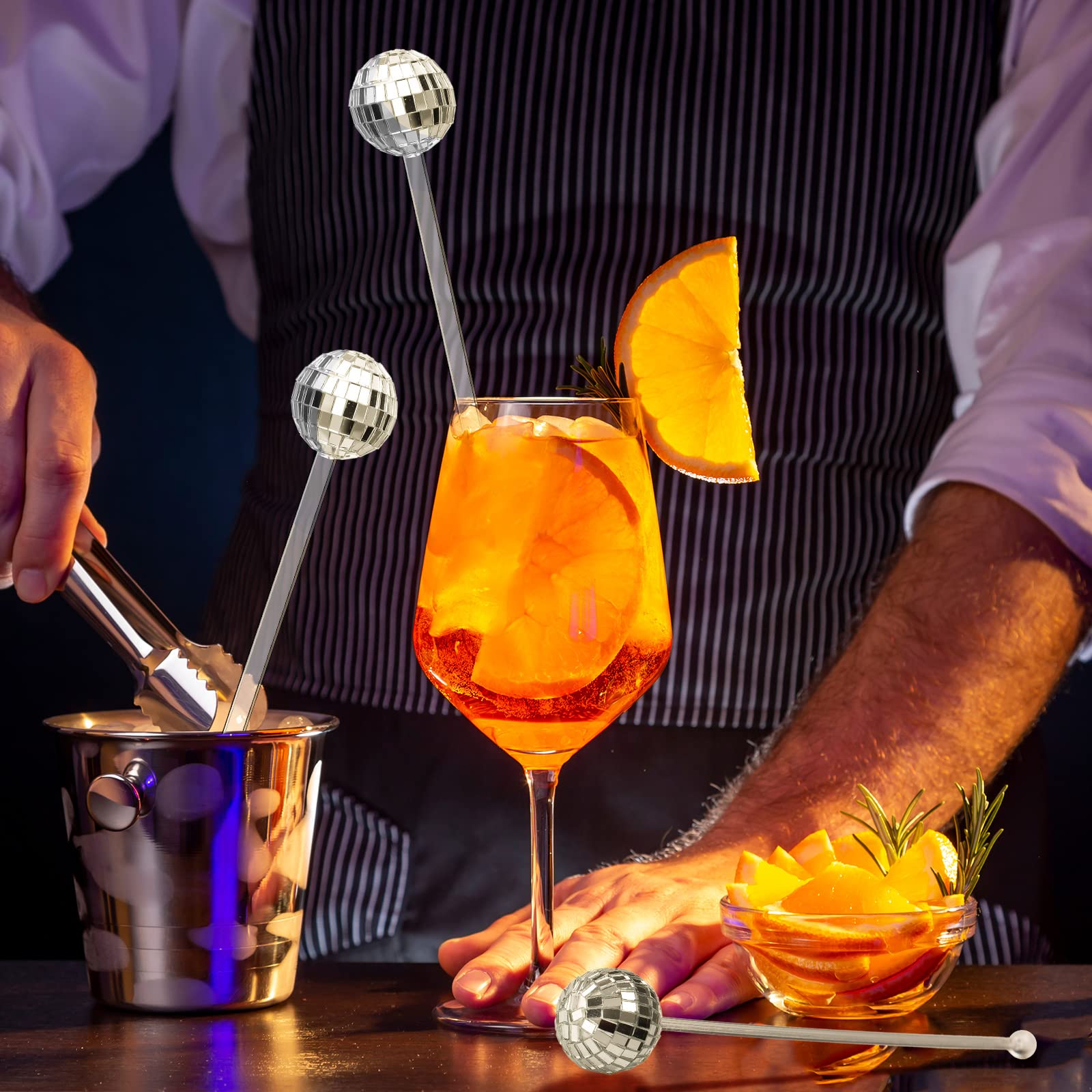 Sawysine party stirrers sparkle under lights, drawing attention to drinks.