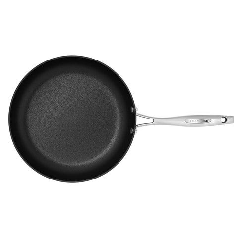 ScanPan HaptIQ 11-inch fry pan in use shows induction readiness and oven-safe design.