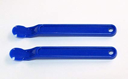 Scotty Peeler blue tool in use removing labels from paper surfaces with minimal residue.