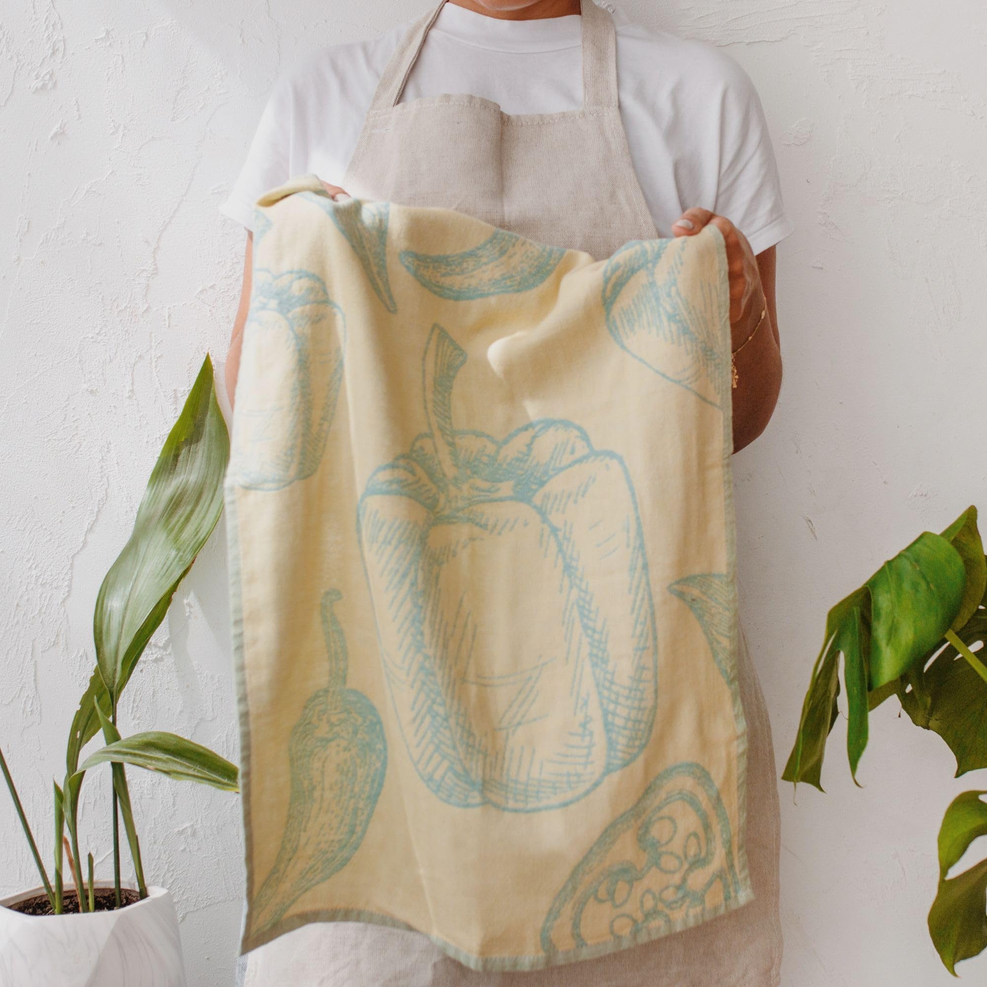 Sea Me At Home dish towels brighten counters while drying dishes.