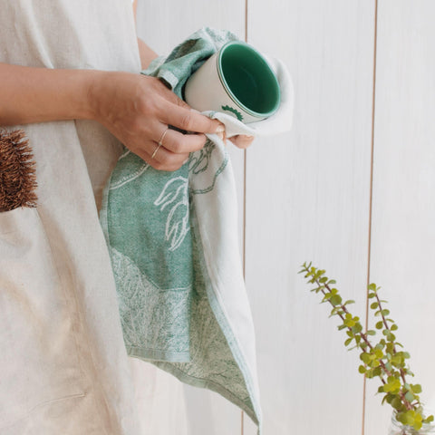 Sea Me At Home towels serve as decorative kitchen accents and practical tools.