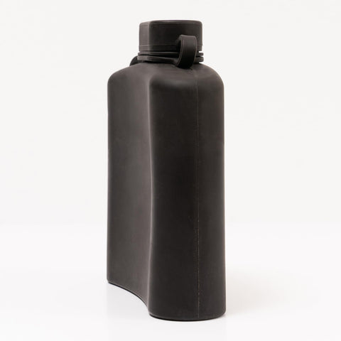 Secret Swig hip flask tucked in a pocket for discreet portability