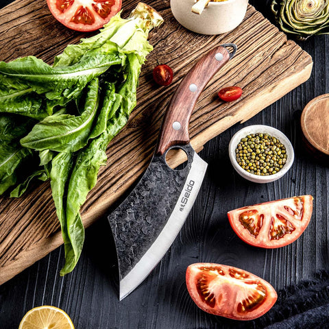 Seido Knives Hakai bone-chop action demonstrating heavy-duty performance on tough cuts.