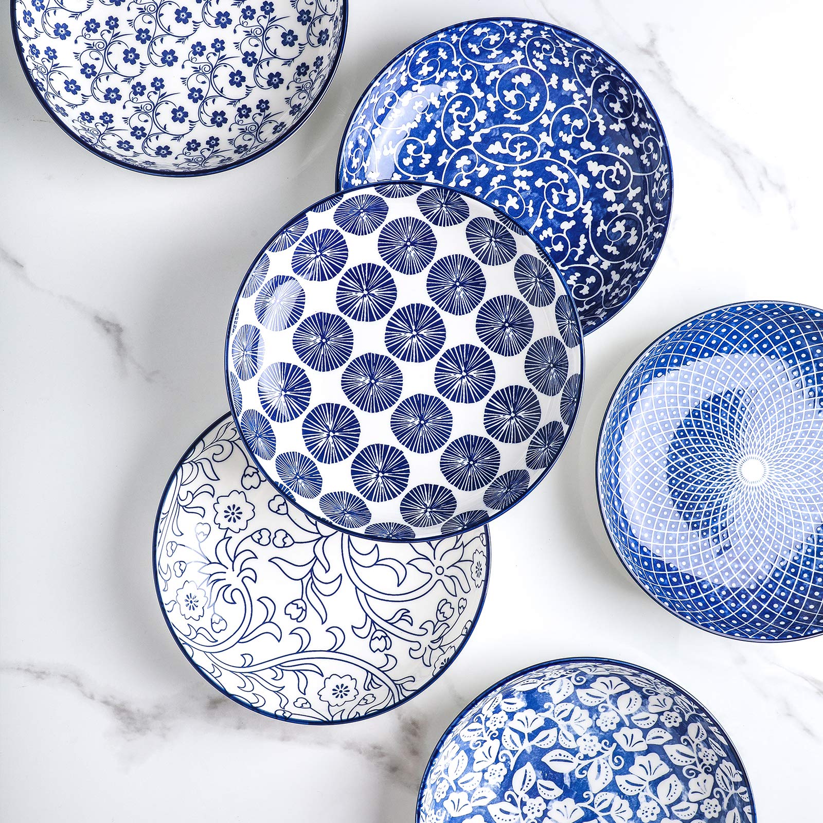 Selamica stackable display of bowls keeps cabinets organized.