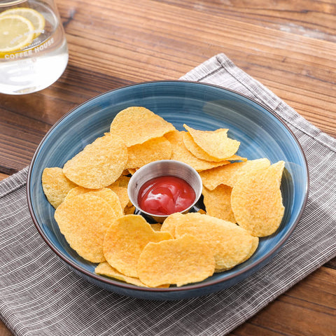 Selamica serving bowls for steaks and appetizers shown on table.