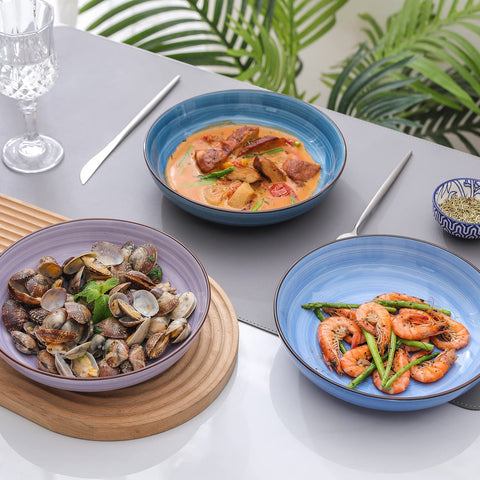 Selamica gradient blue dinnerware on a stylish kitchen table setting.