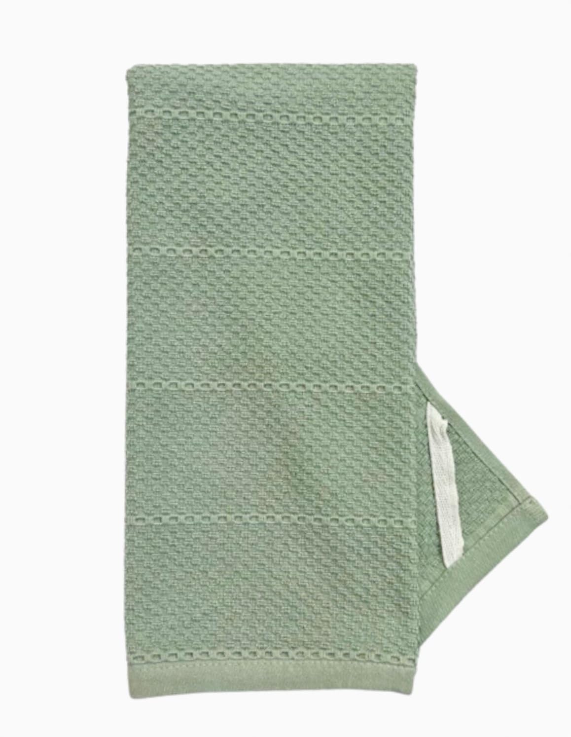 Serafina Home Sage Green towels in use during kitchen cleanup