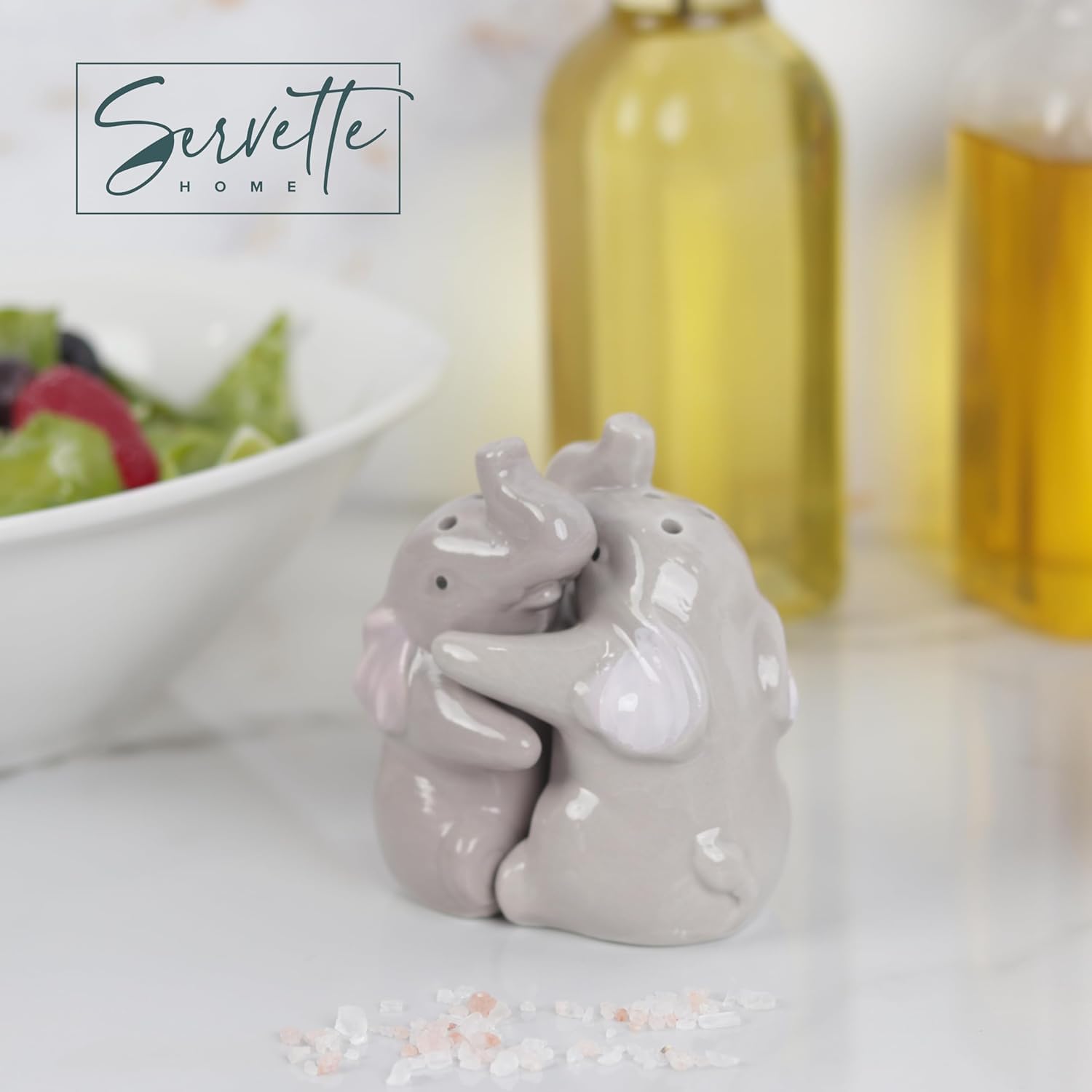 Servette Home hugging elephants closeup highlighting farmhouse charm for kitchen decor.