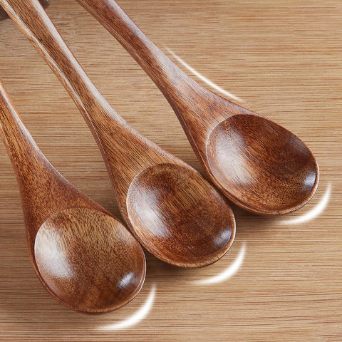 Sevensun wooden spoon dipping honey highlighting natural grain