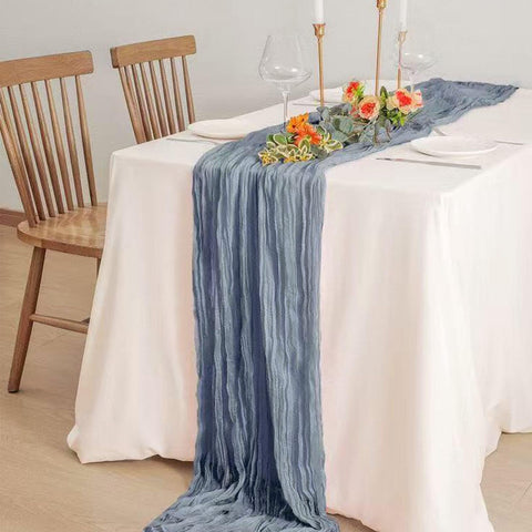 Seveups dusty blue cheesecloth table runner wrinkle texture close-up for refined decor.