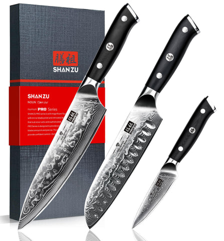 SHAN ZU Damascus knife blades close-up showing 67-layer steel for durability