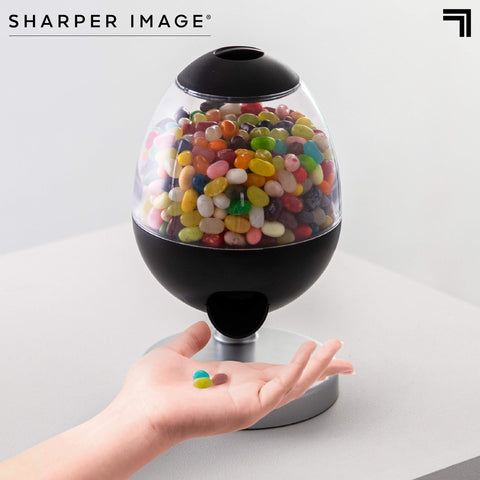 Sharper Image 0.5-liter capacity candy dispenser keeps snacks neatly with fewer refills.