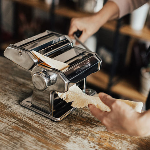Shule pasta roller and cutters in action for fresh noodles.