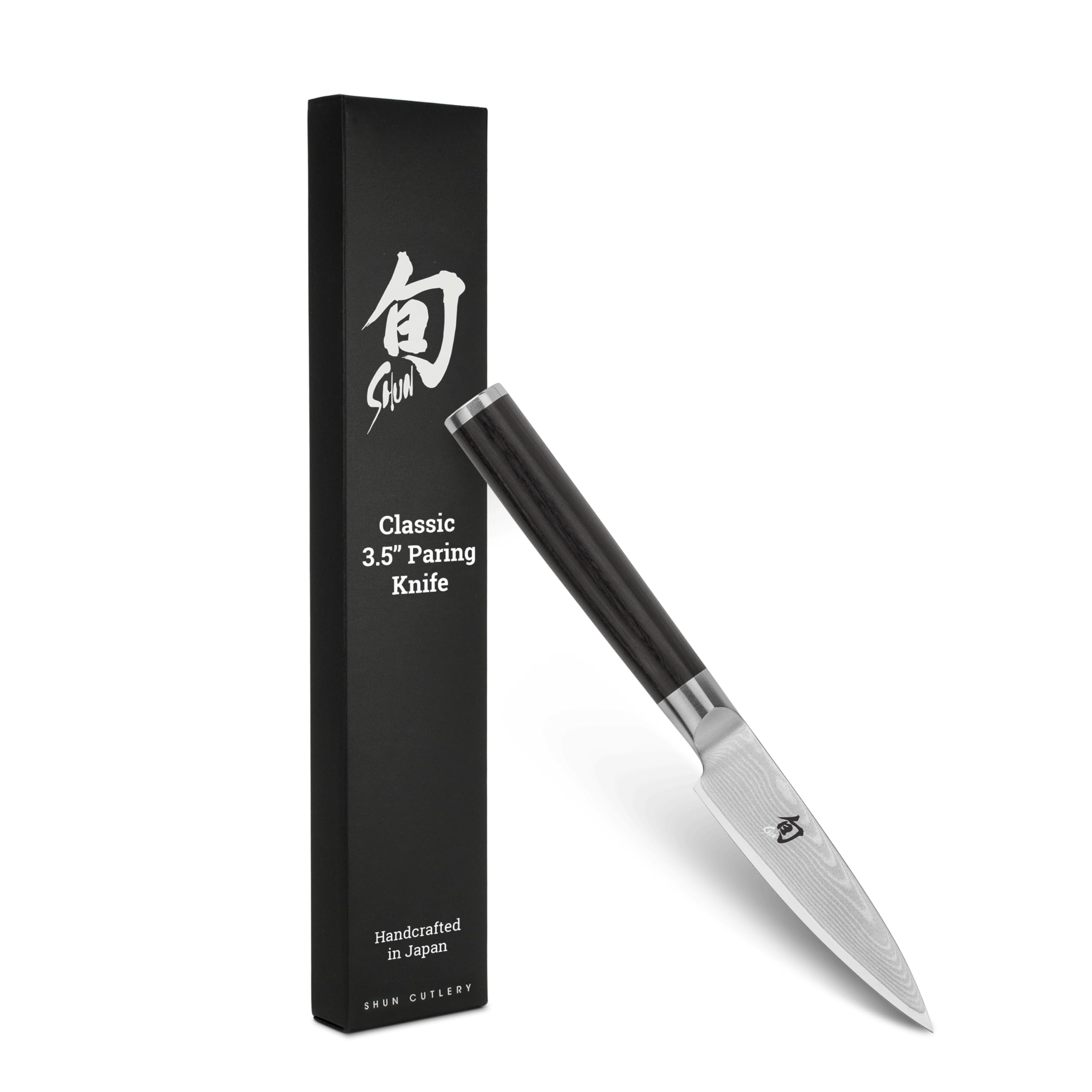 Shun Classic paring knife blade close-up showing razor-sharp edge for precise peeling.