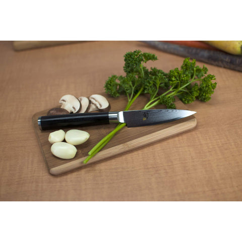 Shun Classic paring knife with D-shaped Pakkawood handle for comfortable control.