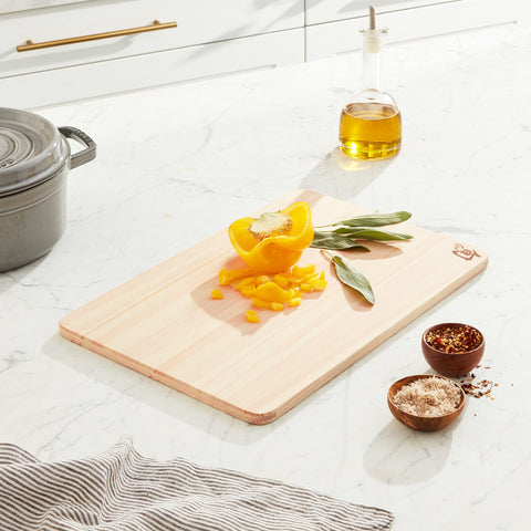 Shun Hinoki cutting board medium side profile showing double-sided versatility for tasks.