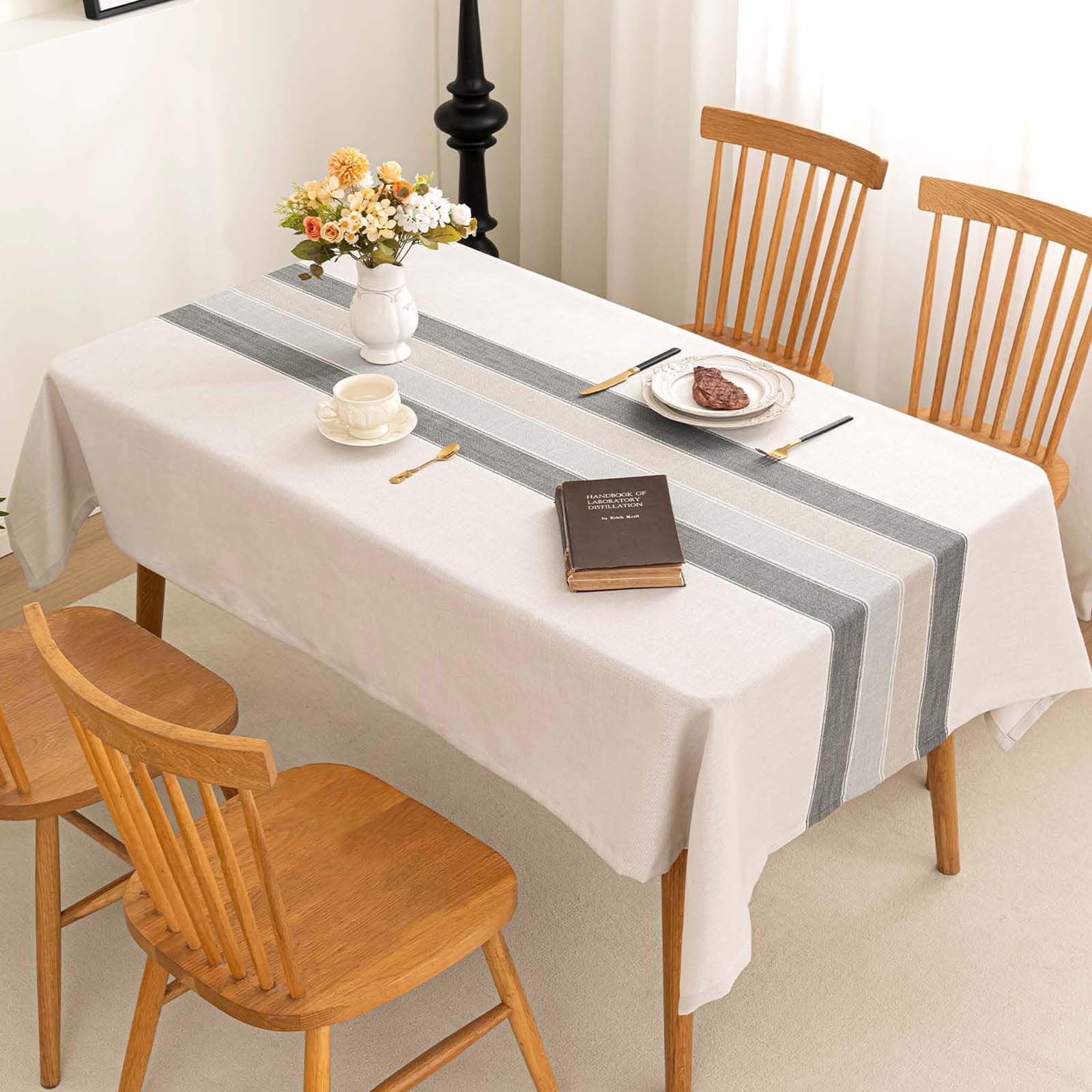 SIELUNO tablecloth shows embroidered stripes and plaid for rustic charm.