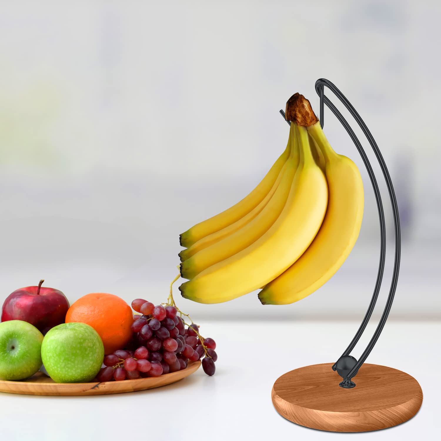 Signice banana storage stand supports headphones or grapes as alternative uses.