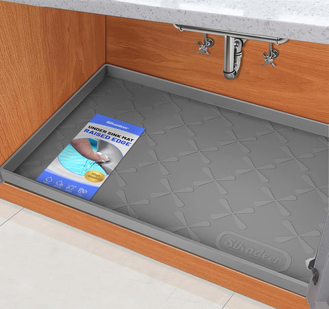 SIKADEER under sink mat with protective edges guards cabinets from leaks.