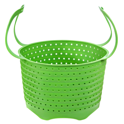 Silikong silicone steamer basket folded for compact storage in a tidy kitchen.