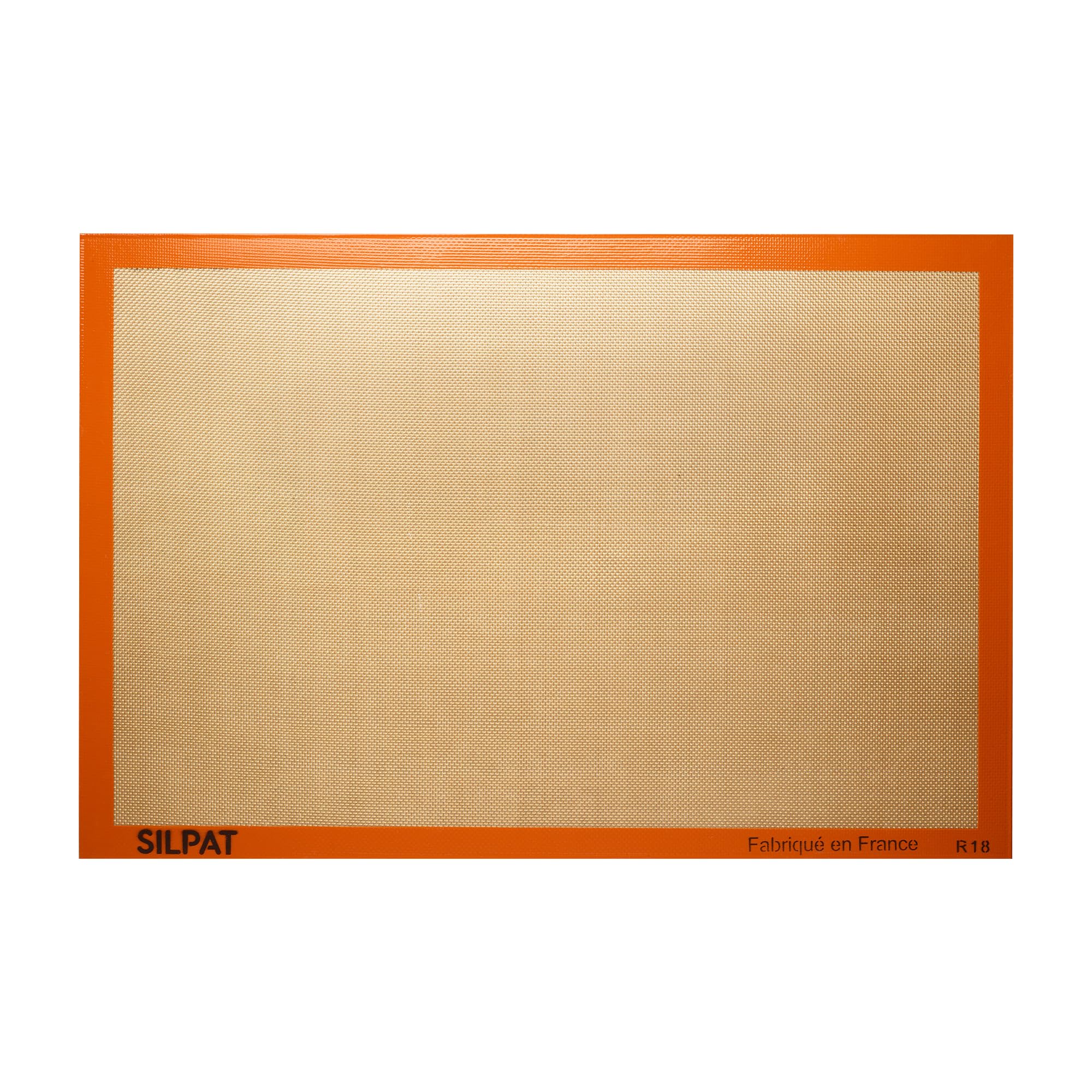 Silpat original non-stick baking mat full size on a sheet pan for easy cleanup.