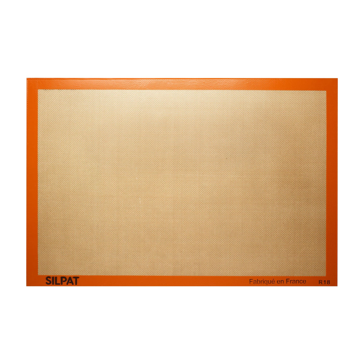 Silpat original non-stick baking mat full size on a sheet pan for easy cleanup.