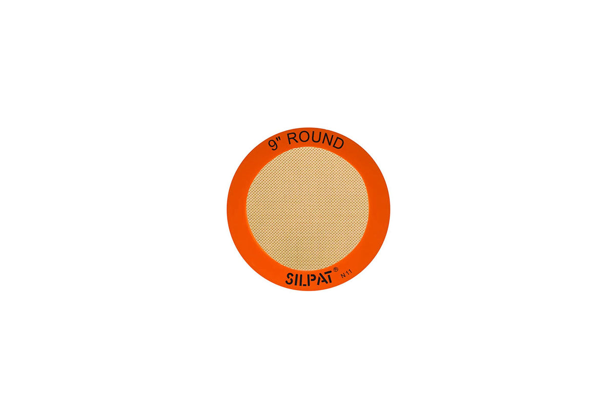Silpat original round baking mat with a non-stick surface for easy cake release.