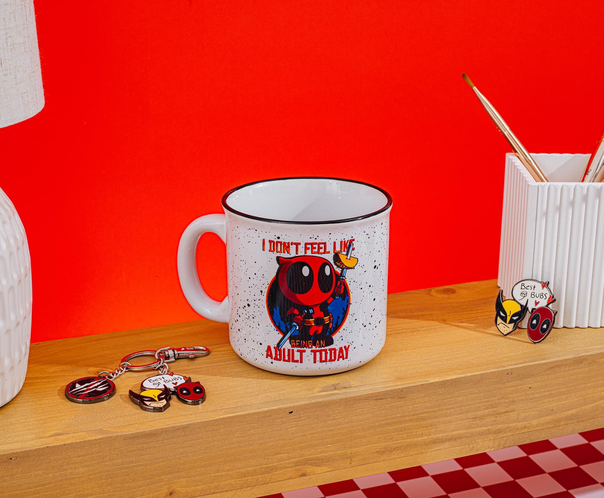 Silver Buffalo Deadpool mug in a desk setup for home or office use.