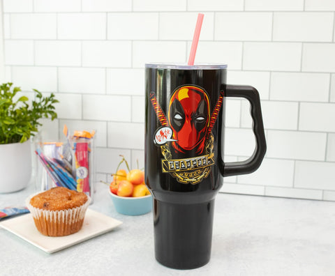 Silver Buffalo Deadpool tumbler fits standard cup holder for car trips.