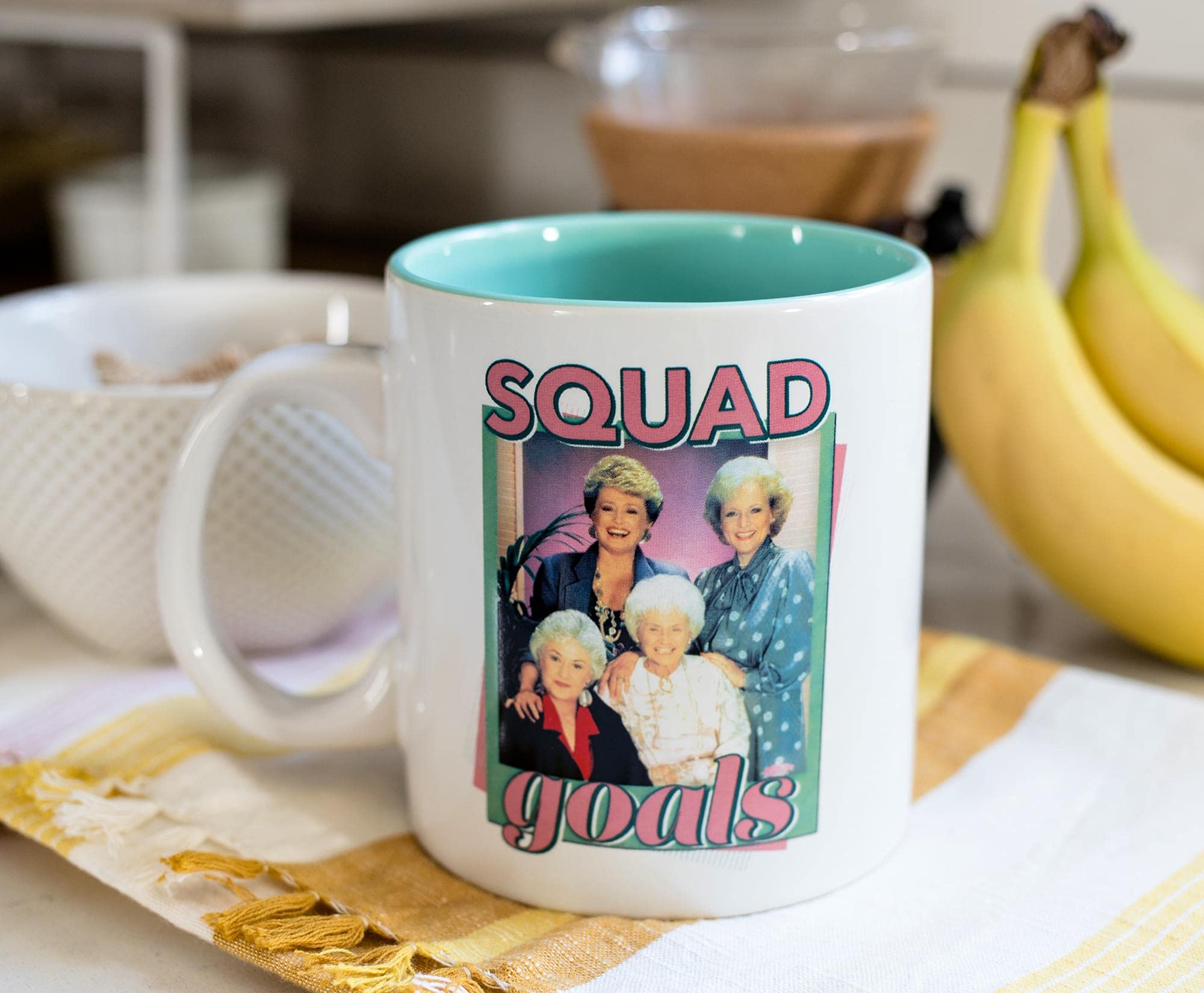 Silver Buffalo mug side text features Squad Goals to brighten your kitchen.