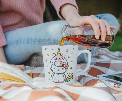 Silver Buffalo Hello Kitty Unicorn mug on a cozy table displaying whimsy and charm.