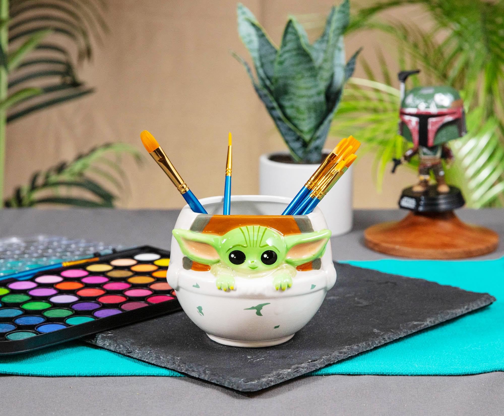 Silver Buffalo Mandalorian Baby Yoda mug with coffee on desk