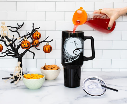 Silver Buffalo tumbler includes a straw for easy sipping.