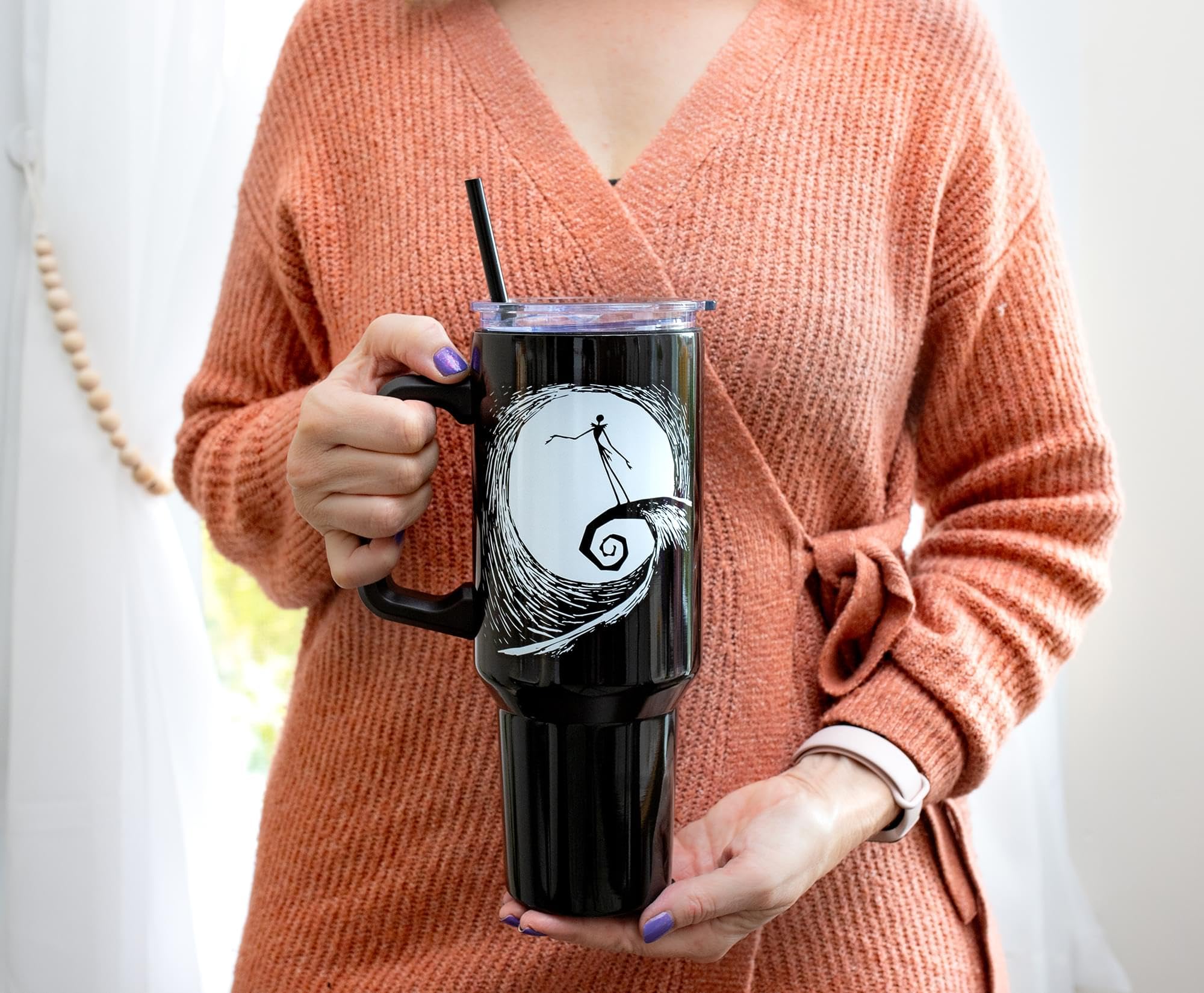 Silver Buffalo tumbler fits standard cup holders for easy travel.