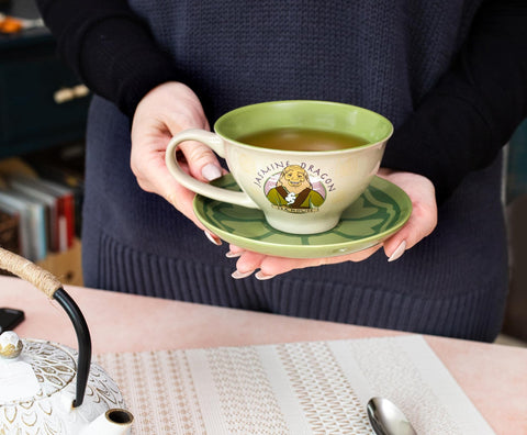 Silver Buffalo teacup shows Jasmine Dragon logo for a tea house vibe.