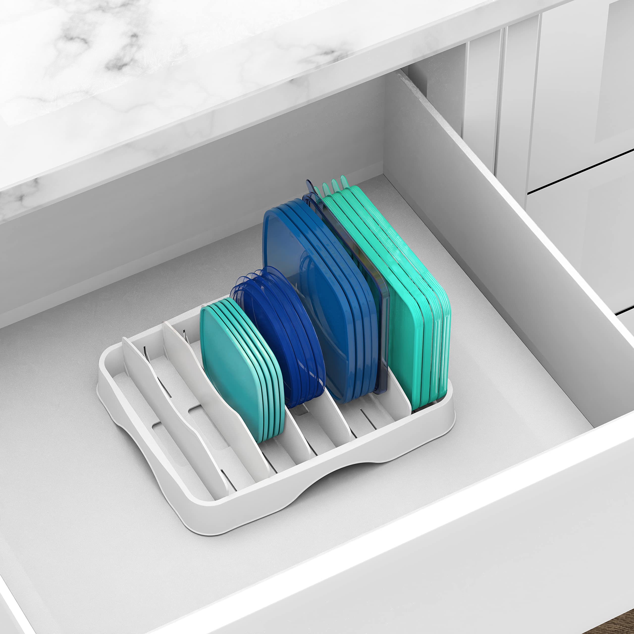 Simple Houseware close-up of finished white storage for kitchen lids.