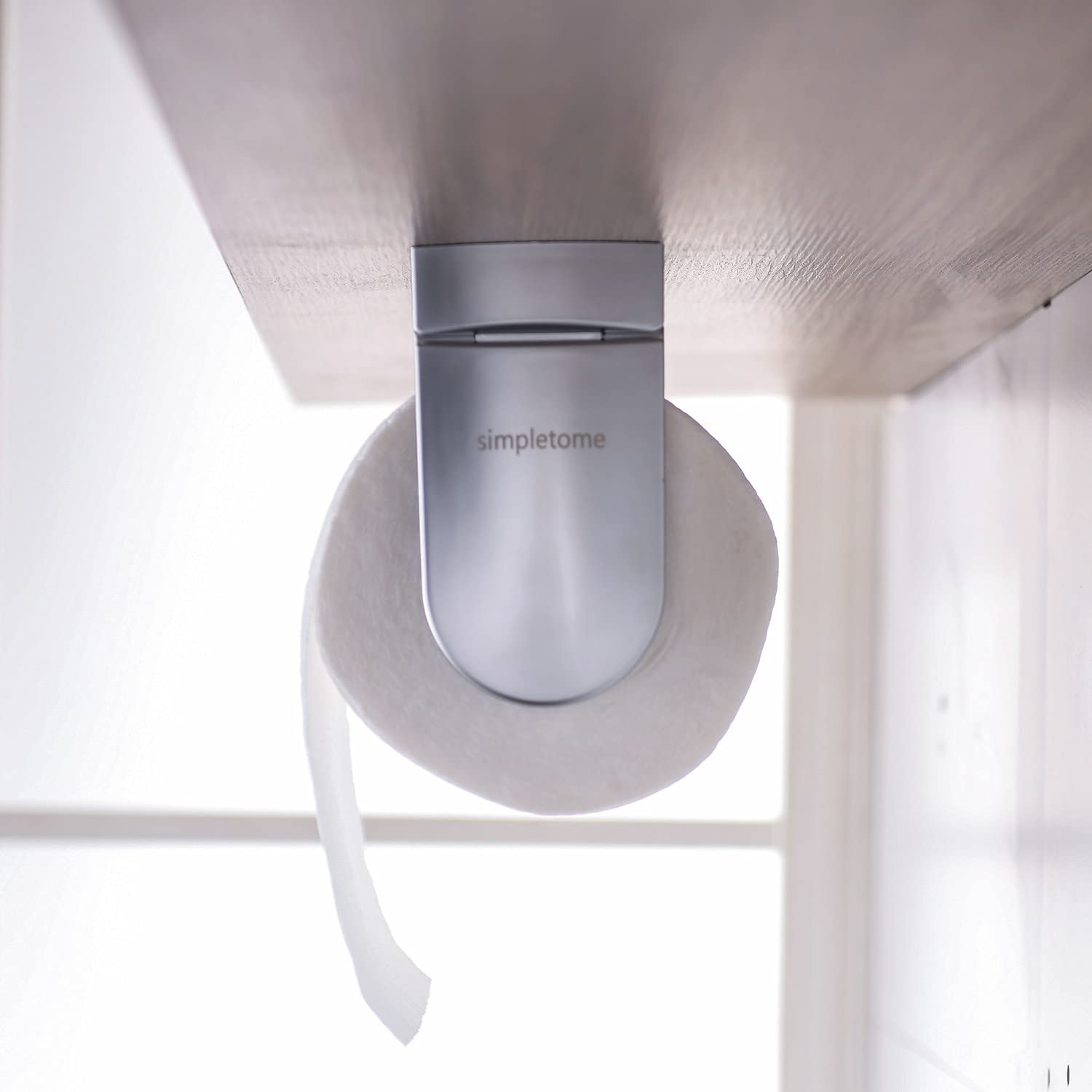 under-cabinet towel holder keeps counters tidy and accessible