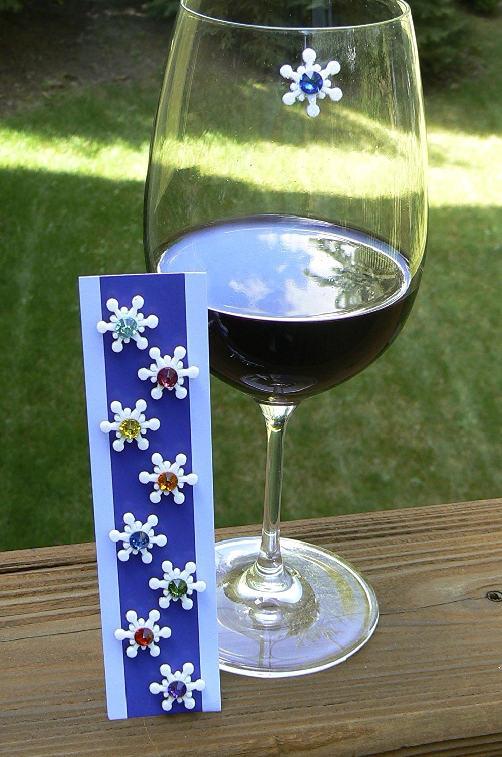 Simply Charmed magnetic wine charms on glass add festive snowflake style to any party.