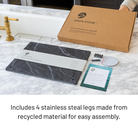 Siren Stone mat complements kitchen décor with dark slate tones.