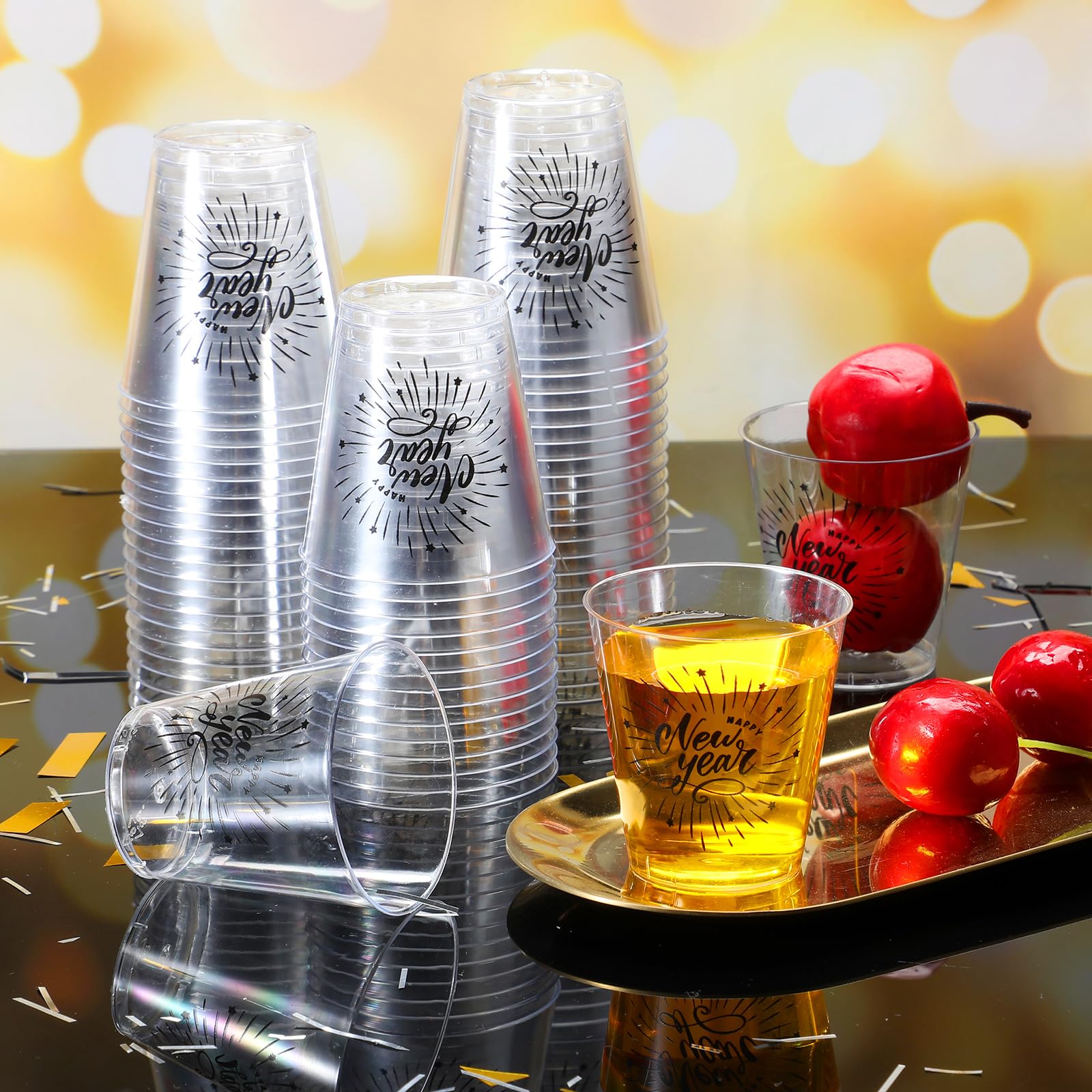 Sliner clear plastic shot glasses with New Year design for easy serving.