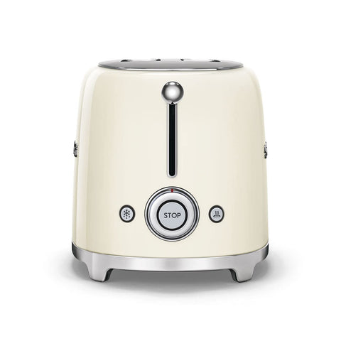 Smeg TSF01 cream removable crumb tray for quick cleaning after breakfast.